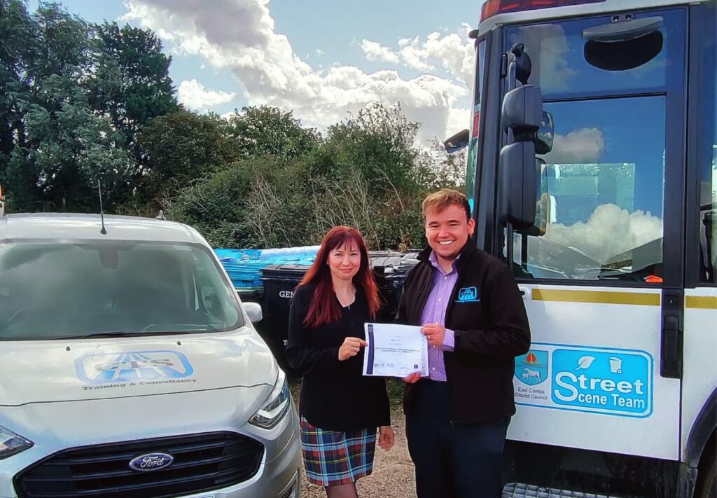 Tom presents Claire from East Cambs Council with her Transport Manager CPC certificate