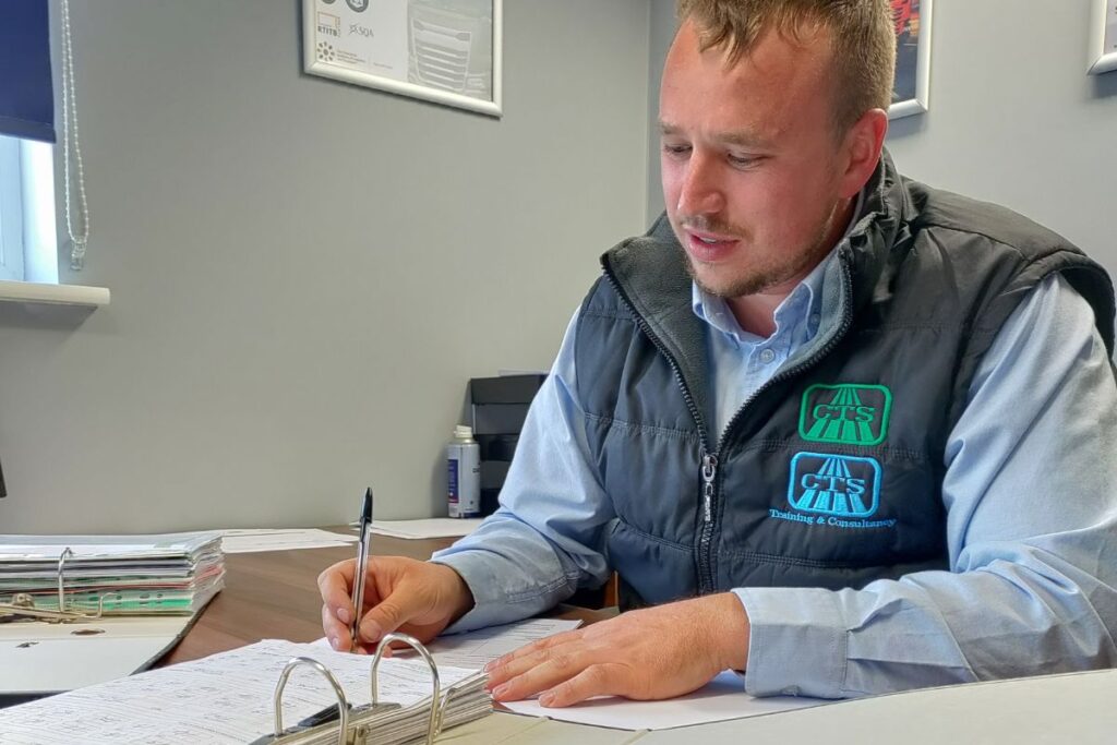 Craig Cooper reviewing maintenance folders